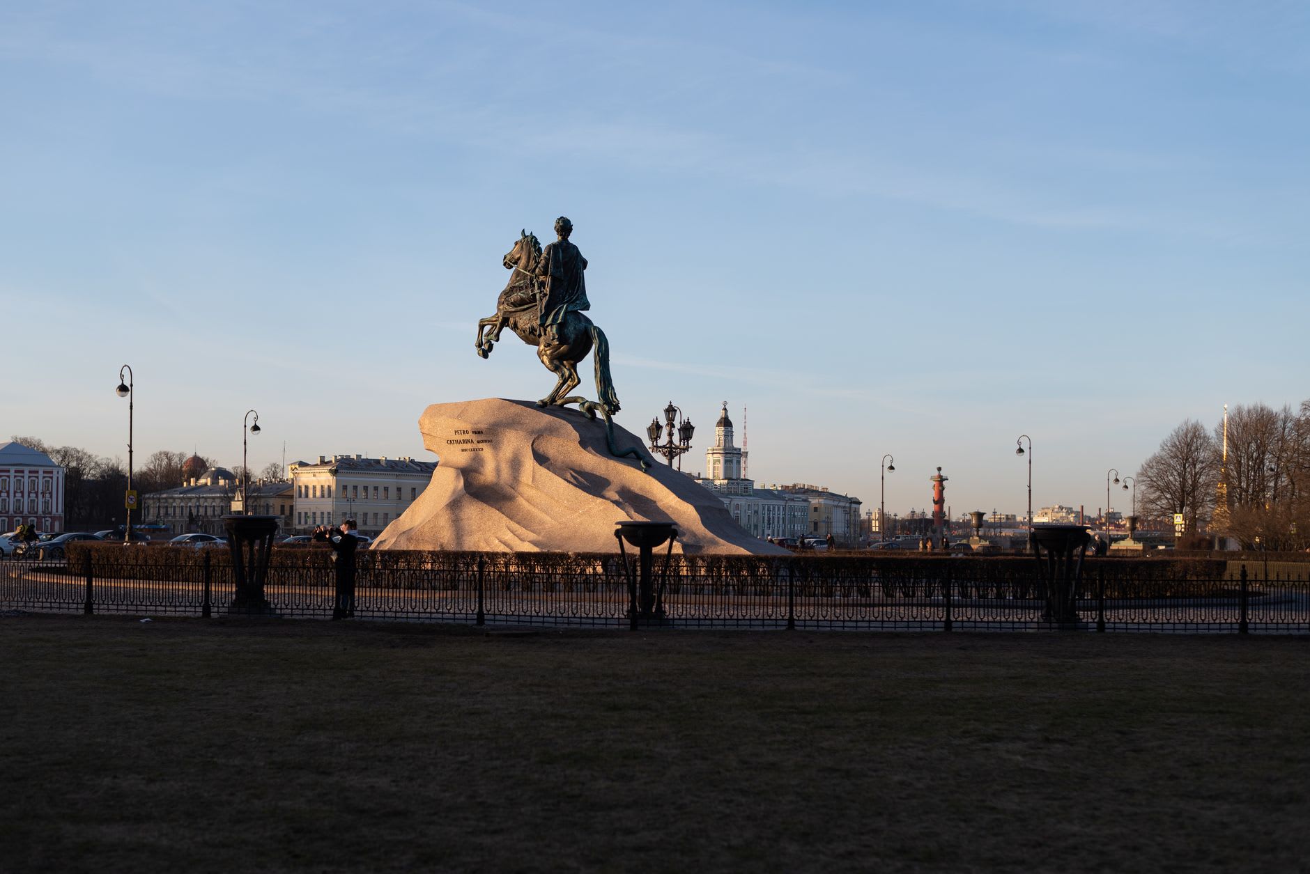 The Hermitage Museum's Winter Palace facade reflecting in a puddle on Palace Square, a winter morning