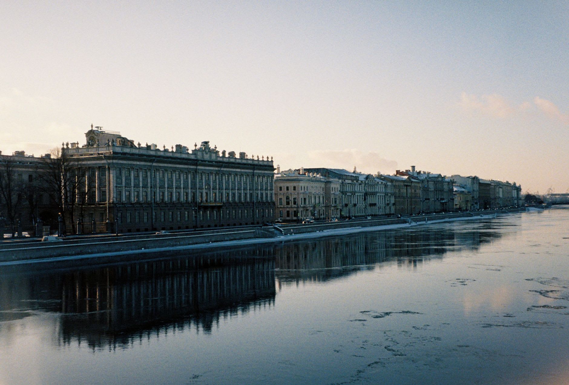 The Griboedov Canal in summer with its bridges and crumbling baroque facades reflected in still water