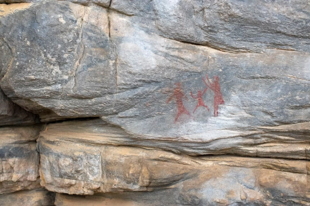 Amerindian petroglyphs carved into rock near a natural pool at Balenbouche Estate