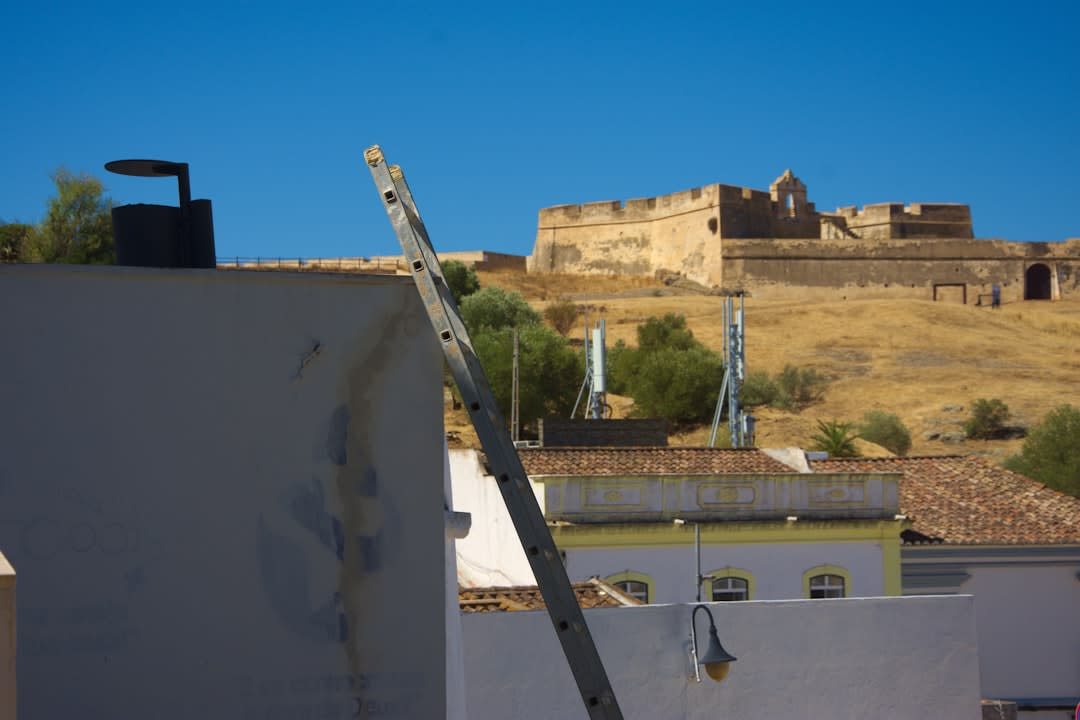 The ruined ramparts of Fort Charlotte overlooking green hills and the distant coastline of Saint Vincent