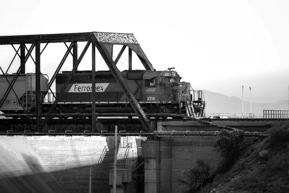 Rail bridge crossing the Rio Toro canyon with switchback tracks visible above