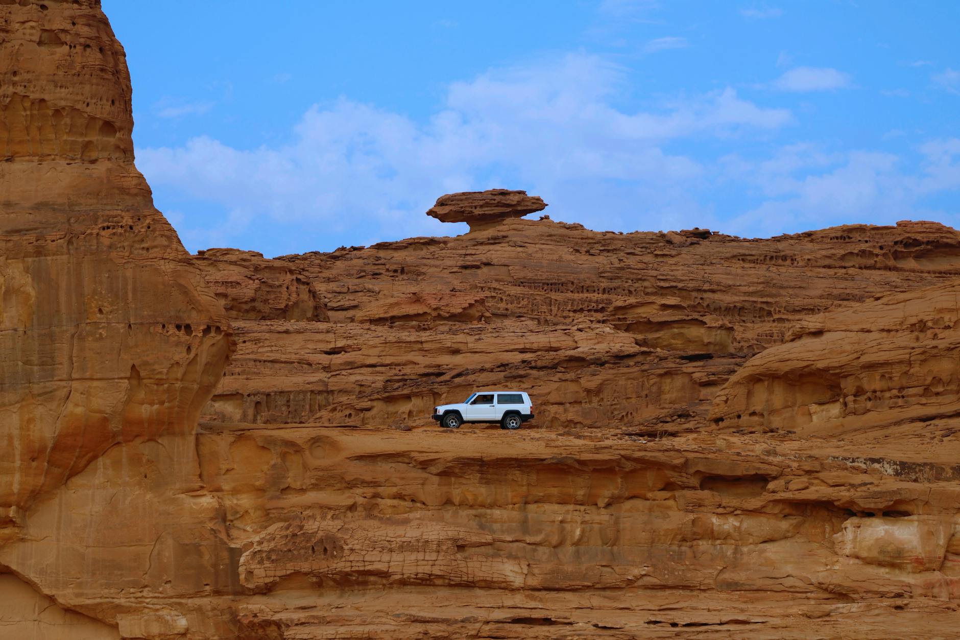 Sandstone formations glowing in AlUla's desert valley
