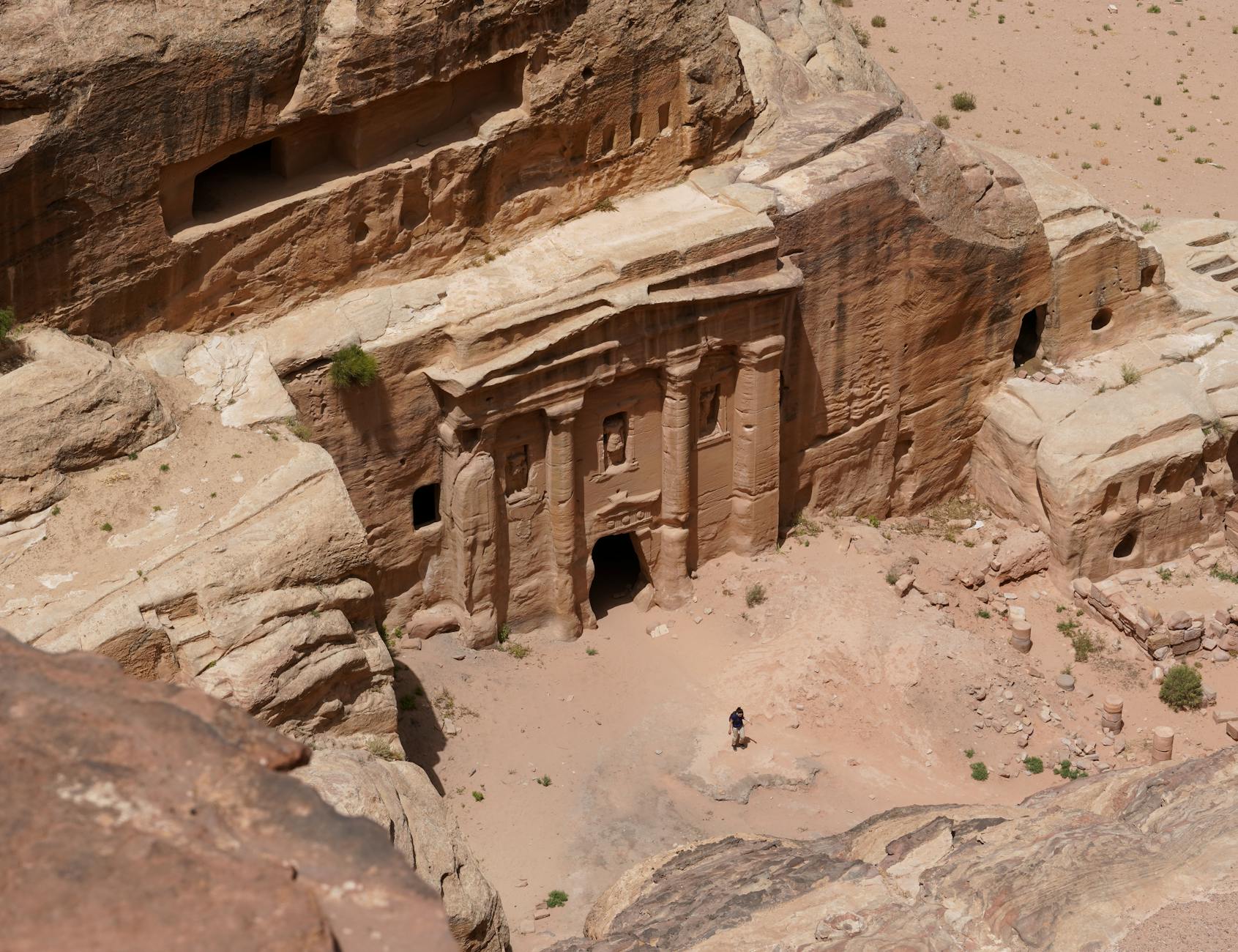 Isolated rock-cut tomb standing alone in the desert at Hegra