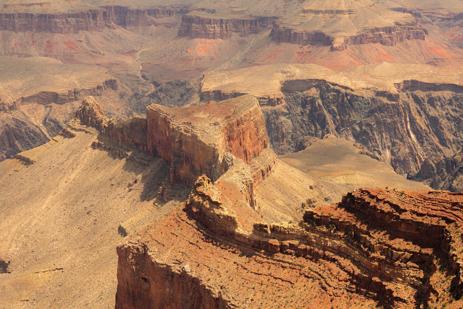 Sheer limestone cliffs of the Tuwaiq Escarpment dropping to the desert plain