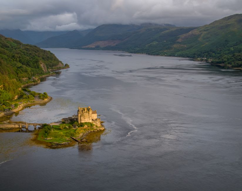 View across the lochs from near Eilean Donan Castle at golden hour