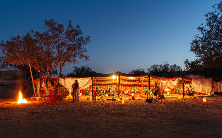 A canvas desert camp tent among the dunes near Lompoul at dusk