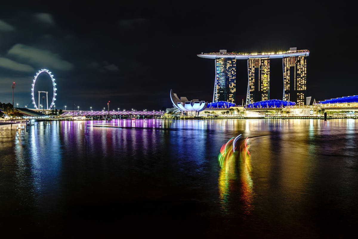 The glittering Singapore skyline reflected in the still waters of Marina Bay