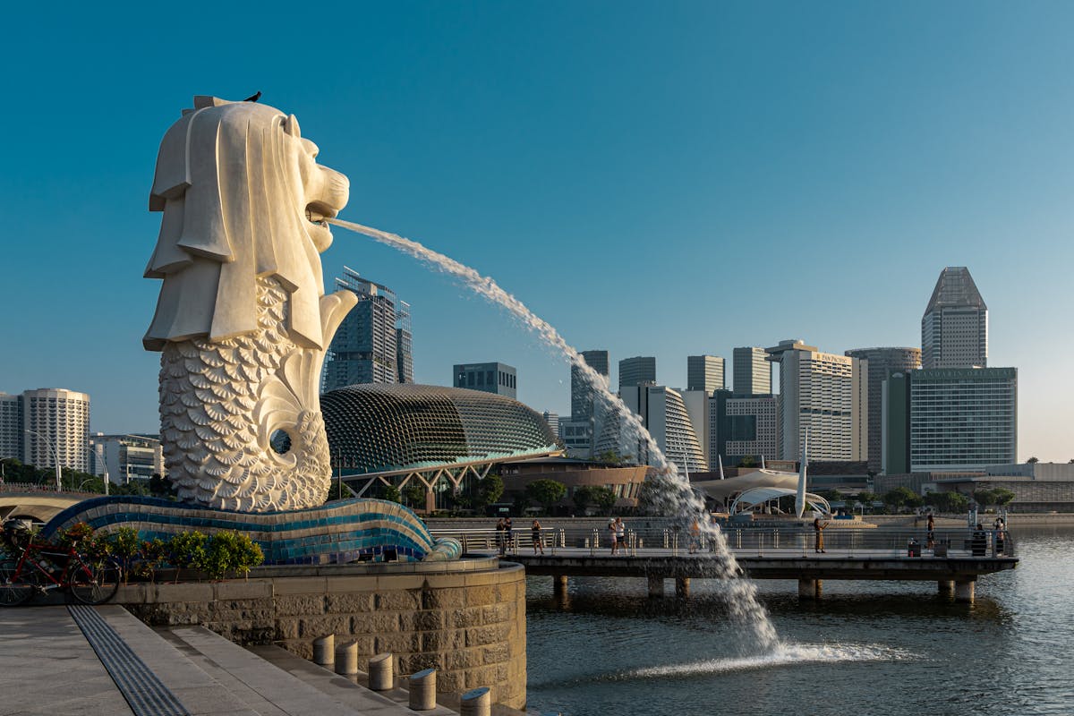 The Merlion fountain with the Marina Bay Sands in the background at sunset