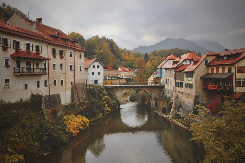 The medieval stone Capuchin Bridge crossing the Selška Sora river in Škofja Loka