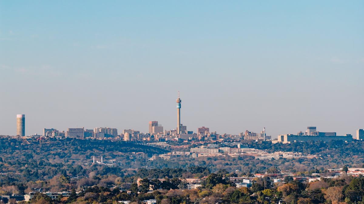 Johannesburg's modern skyline against a dramatic African sky