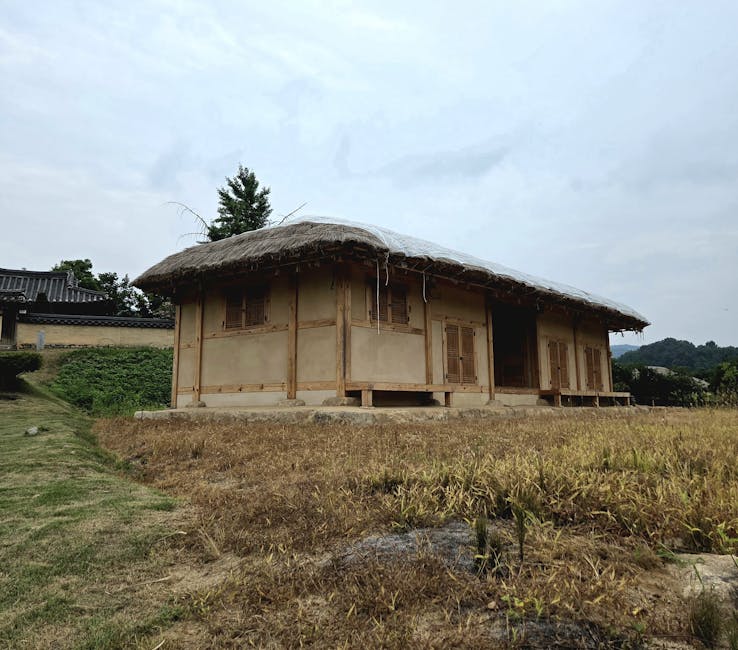 Traditional Korean village nestled among forested mountains