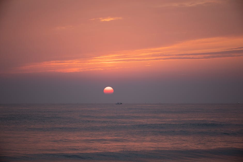 Sunrise over the calm East Sea with rocky coastline