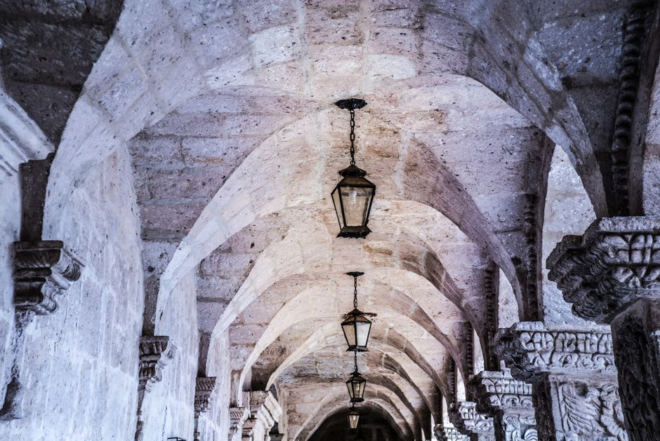Weathered Romanesque cloister of the Colegiata de Santa Juliana with carved stone capitals