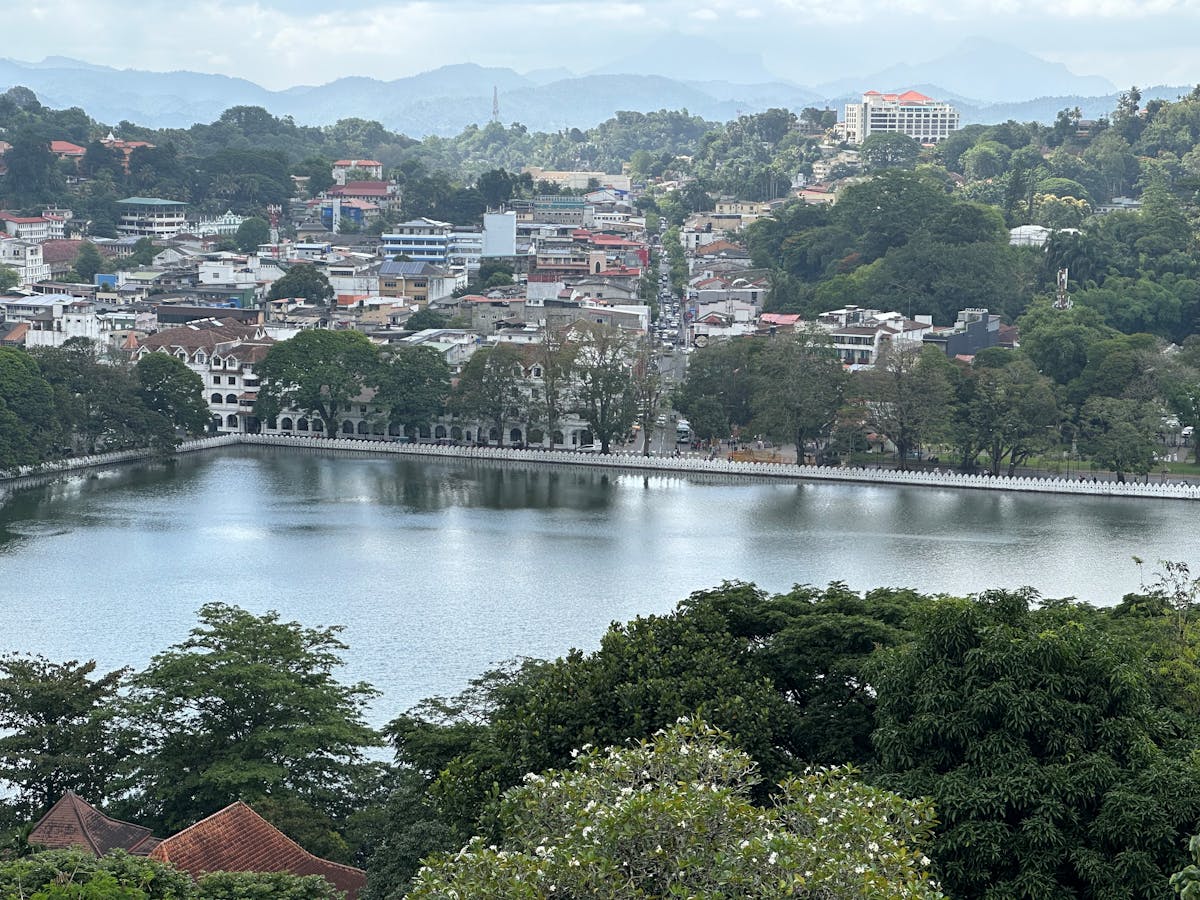 Lush green hills and misty landscape surrounding Kandy