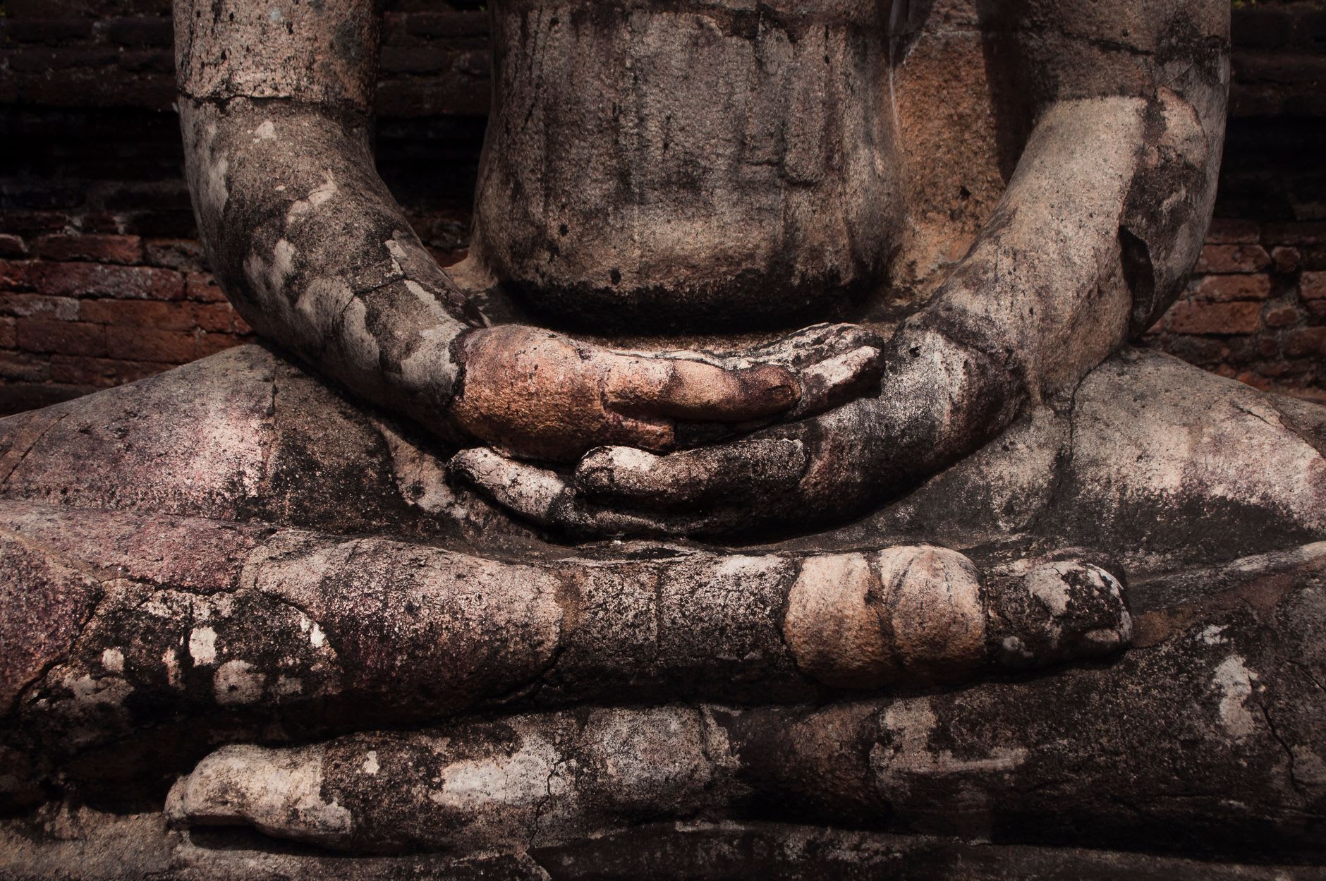 The standing and reclining Buddha figures of Gal Vihara carved from one granite wall in Polonnaruwa, banded grey-and-amber stone catching late light