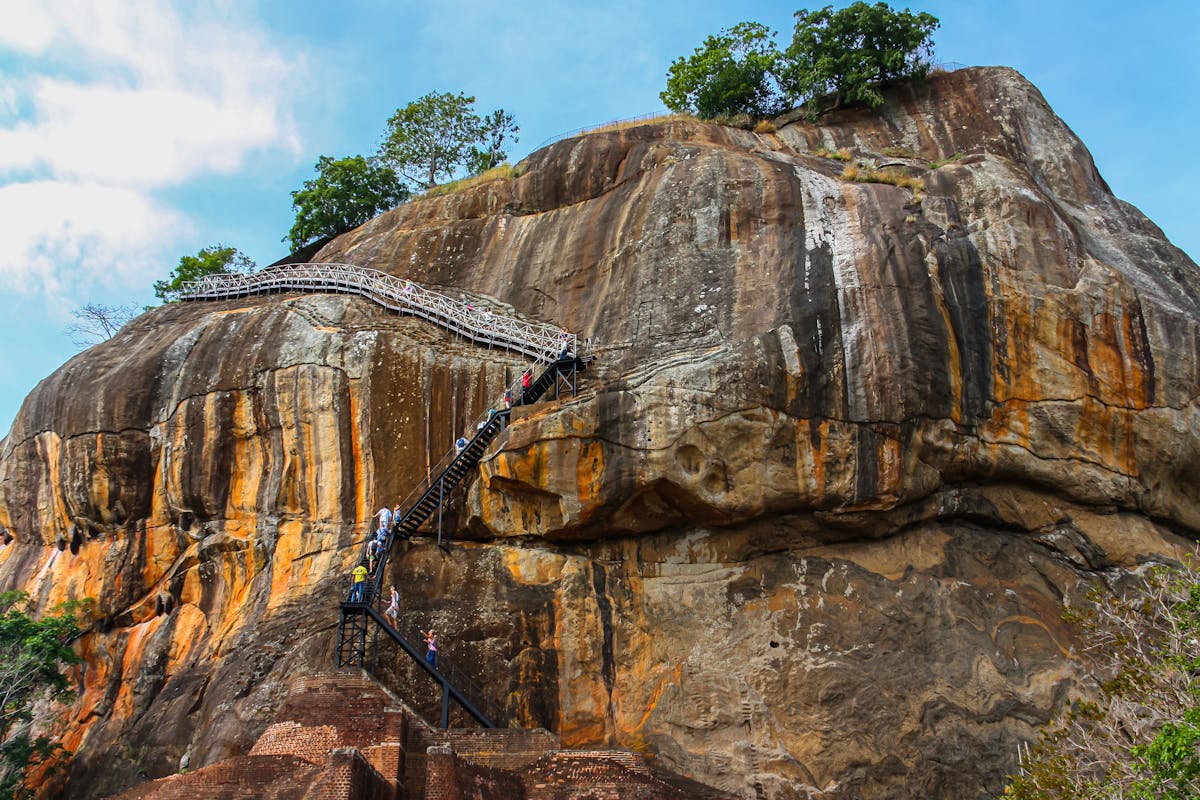 The imposing rock fortress of Sigiriya rising from the green plains