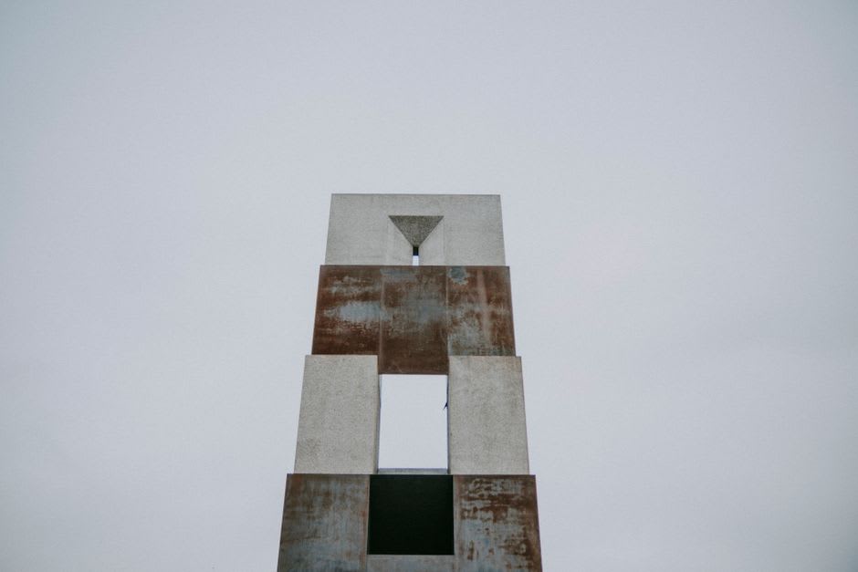 The angular concrete and rusted-steel exterior of the Shihsanhang Museum of Archaeology in Bali, overlooking the Danshui River