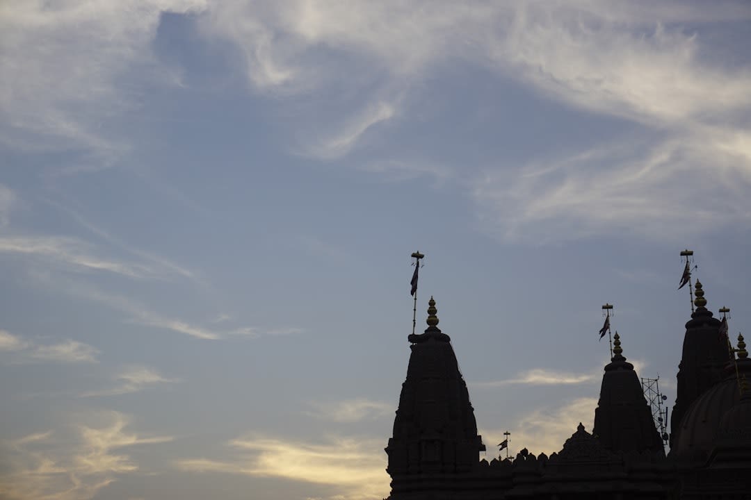 The towering vimana of Brihadisvara Temple against a bright Tamil Nadu sky