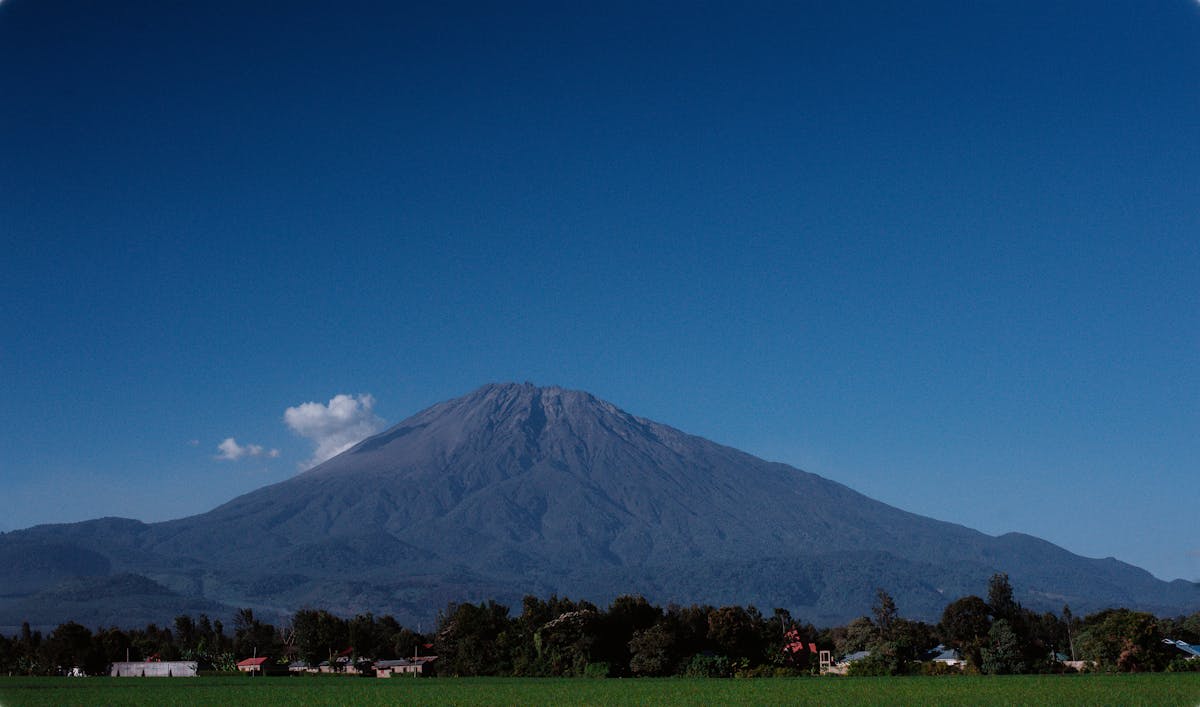 Mount Meru rising above Arusha's lush green landscape