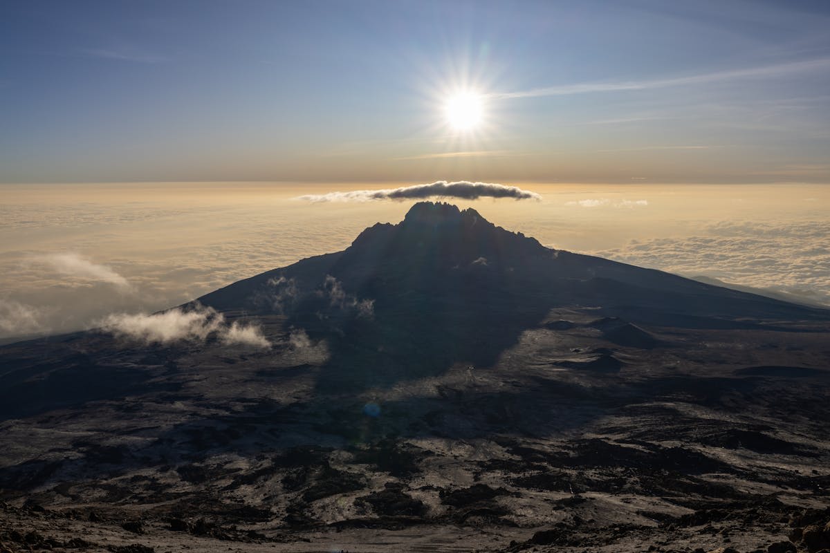The snow-capped summit of Mount Kilimanjaro at golden sunrise