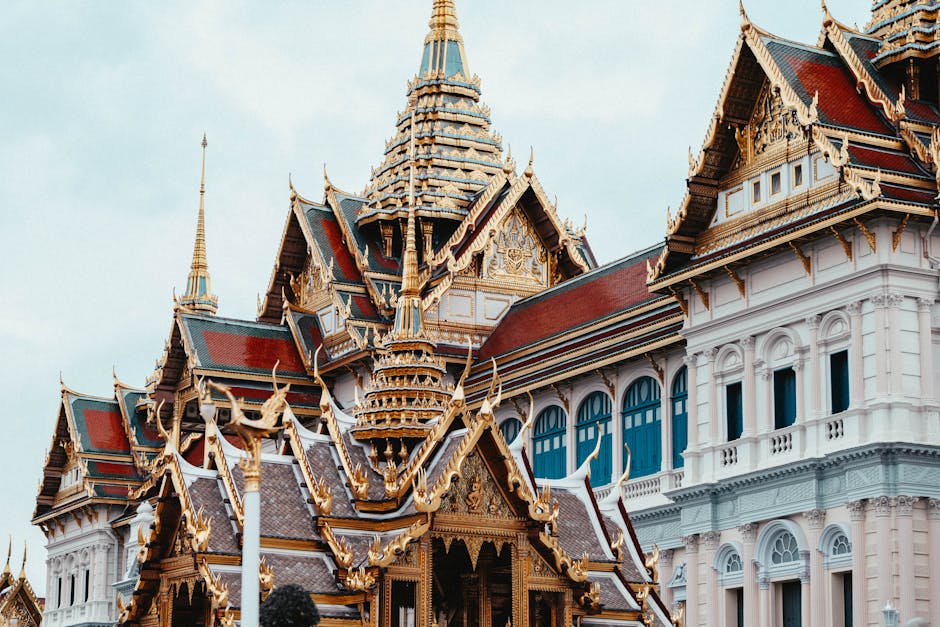 Golden spires of the Grand Palace shimmering in the Bangkok heat