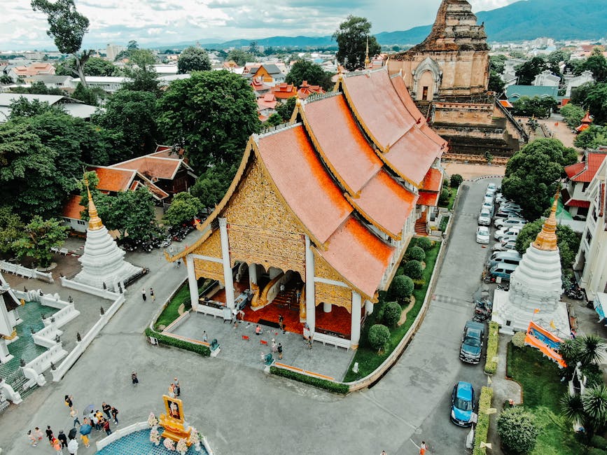 Golden temple spires rising above the trees in Chiang Mai's old town