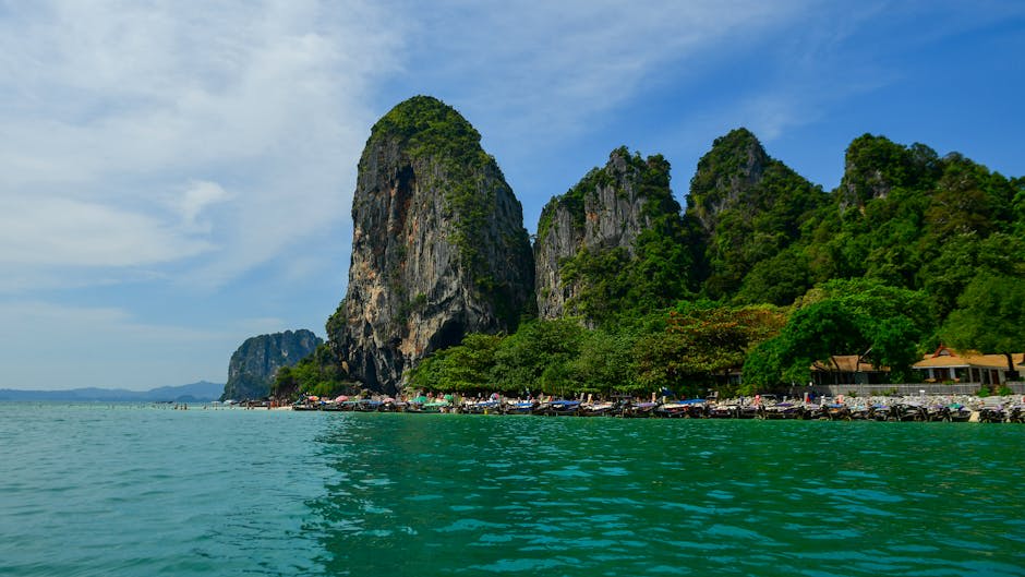Crystal clear emerald water surrounded by jungle in Krabi's nature reserve