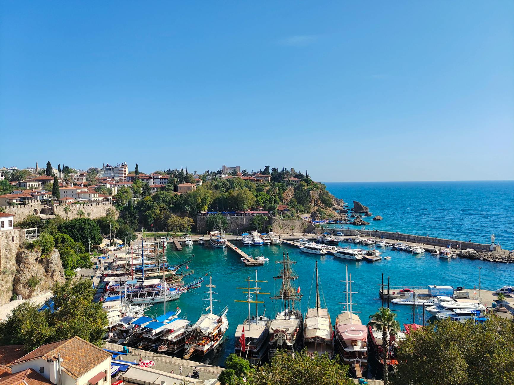 The old town and harbor of Antalya with Mediterranean waters below