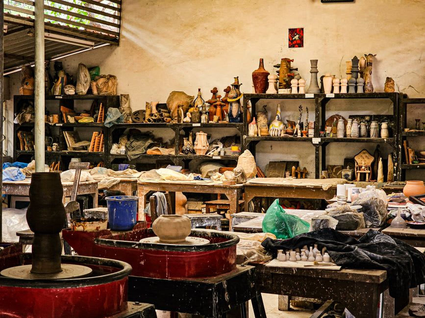 Rows of finished red-clay pottery drying outside a workshop in Avanos