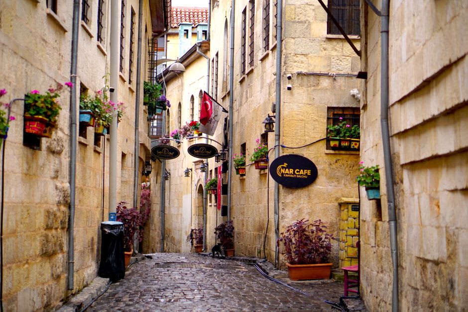A quiet street in Çanakkale's old town near the harbor, with Ottoman-era buildings and cafes