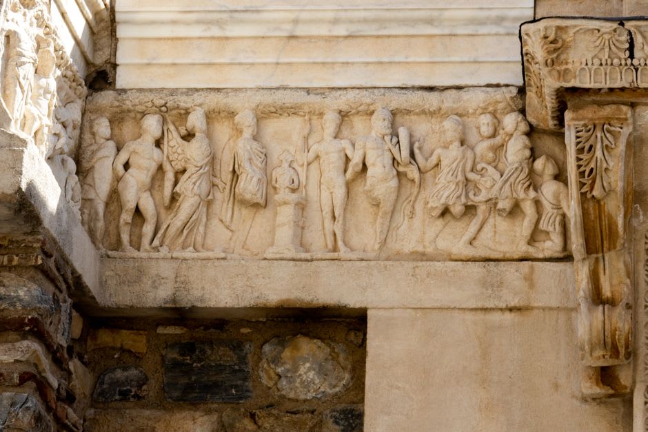 A carved Medusa head relief on fallen marble stonework at the Temple of Apollo, Didyma