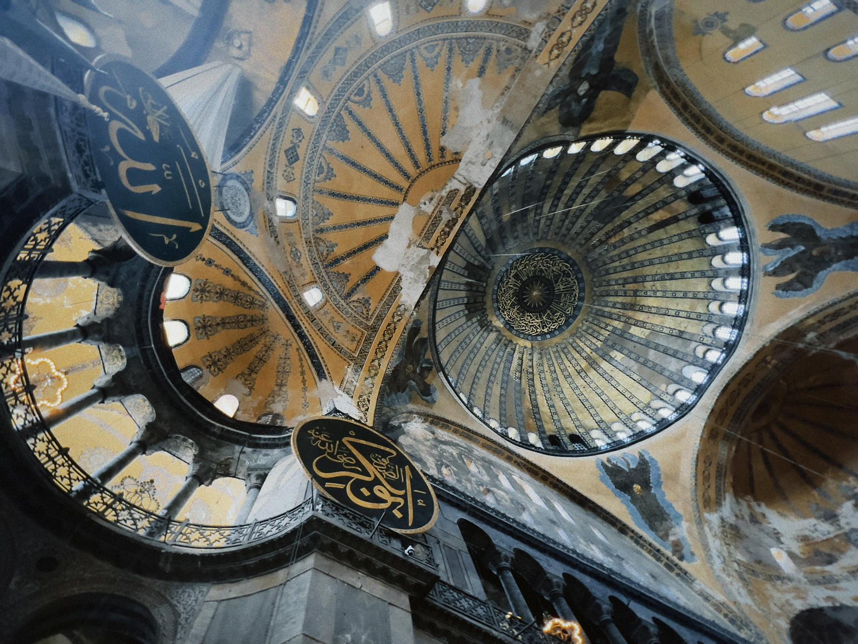 The grand interior of Hagia Sophia with its soaring dome and golden mosaics