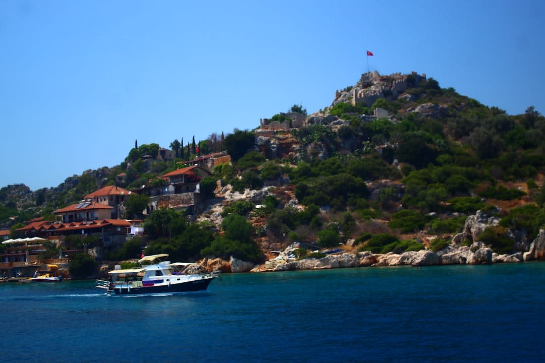 Submerged ancient walls and staircases visible beneath the clear turquoise water of Kekova