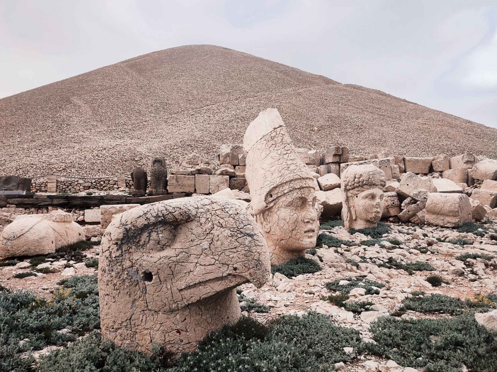 Pierre crouching beside the enormous limestone head of Zeus-Oromasdes, the worn bearded face nearly his height, with the Anatolian plateau stretching to the horizon behind