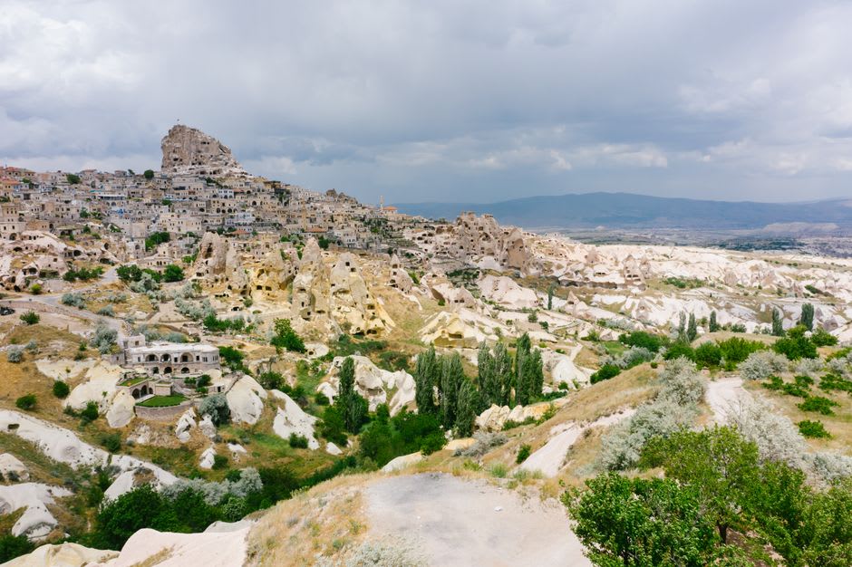 Panoramic view over the Cappadocian valleys from the summit of Uchisar Castle at golden hour