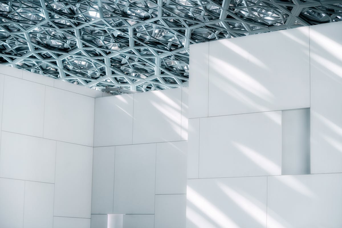 The Louvre Abu Dhabi with its perforated dome over calm waters