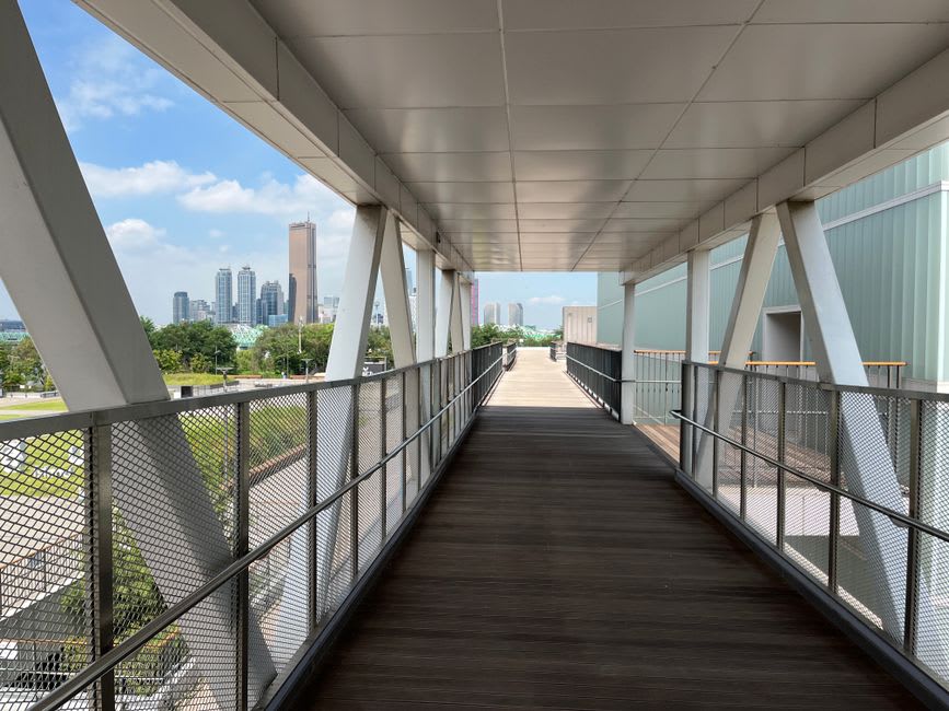 Concrete studio facades with steel detailing along a d3 walkway