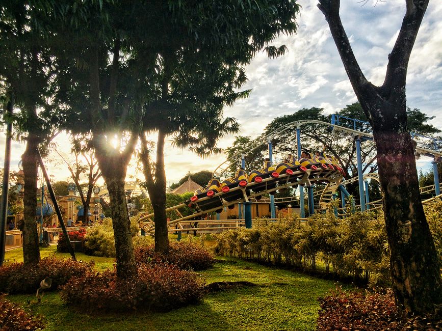 Family riding a themed roller coaster at Motiongate within Dubai Parks and Resorts