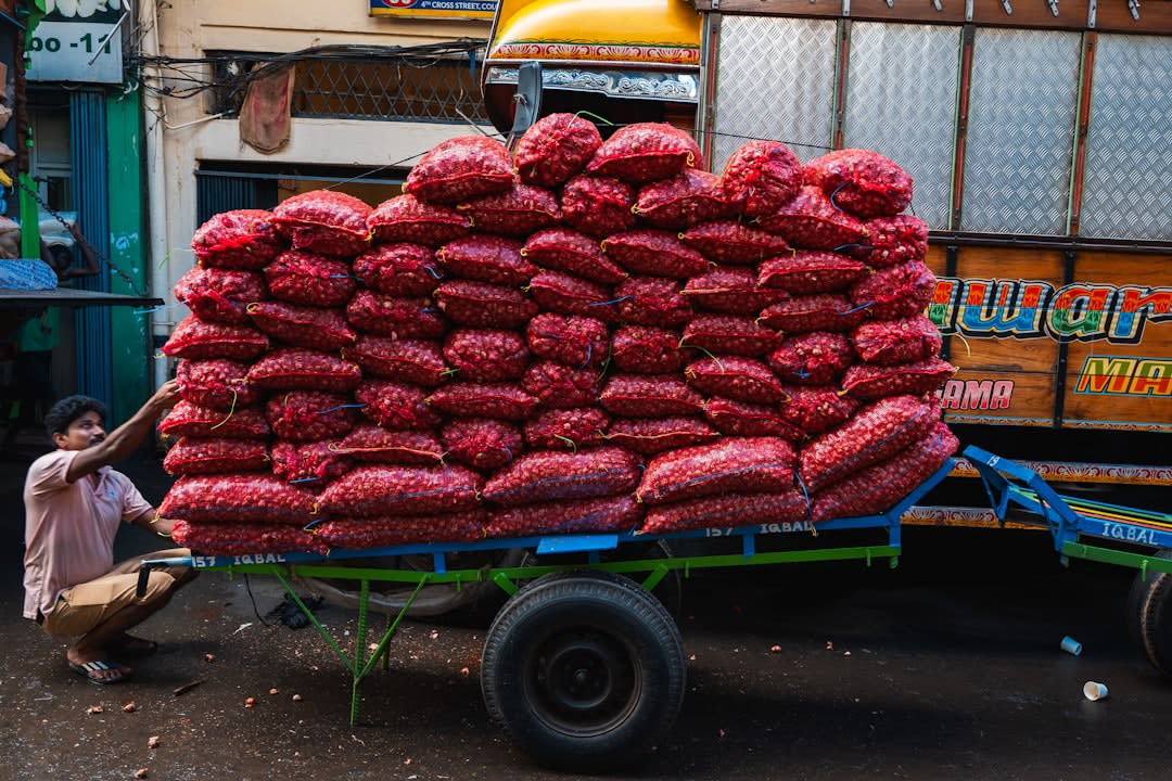 Open burlap sacks of saffron, dried limes, and spices at Dubai Spice Souk