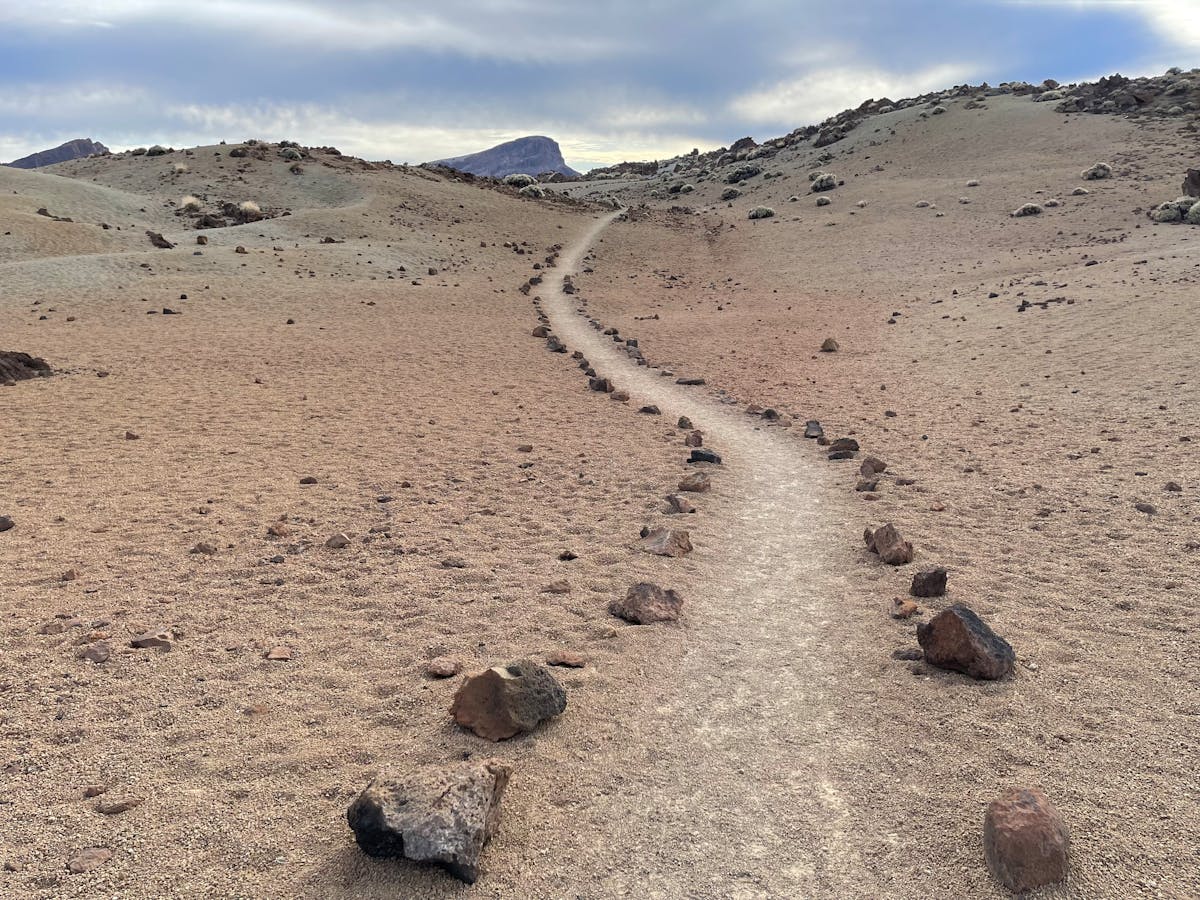 Mountain hiking trail through rocky Hajar Mountain terrain