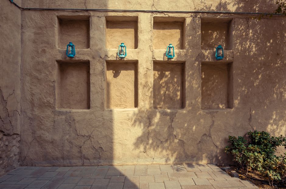 A courtyard with traditional gypsum plasterwork inside a restored Heart of Sharjah building