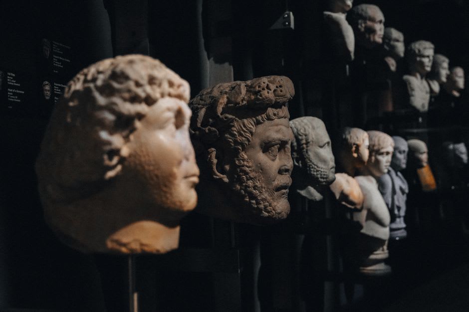 A gallery space at Louvre Abu Dhabi displaying artifacts from different civilizations side by side