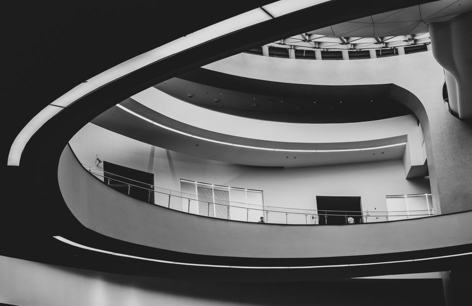 Interior atrium of Museum of the Future with calligraphy-patterned light filtering through the walls