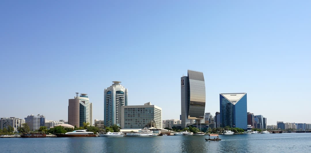 Wooden dhow cargo boats loaded and moored along the banks of Dubai Creek in Deira
