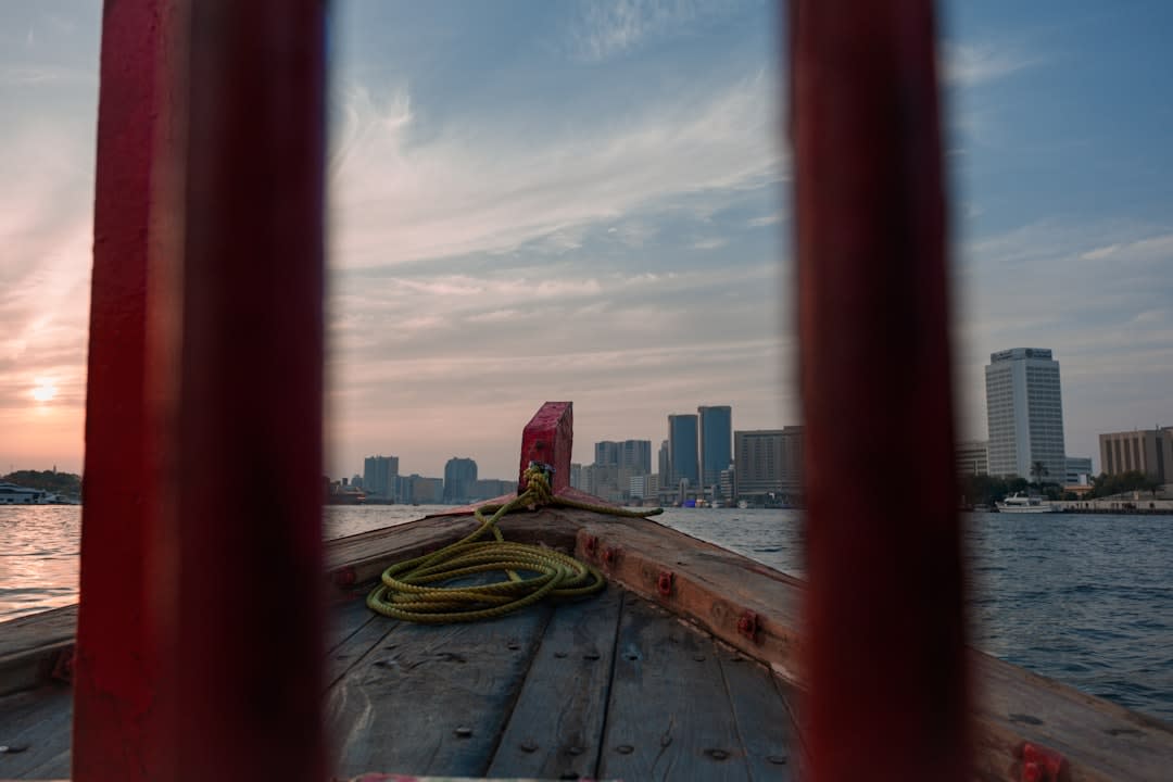 An abra water taxi crossing Dubai Creek toward the Gold Souk in Deira