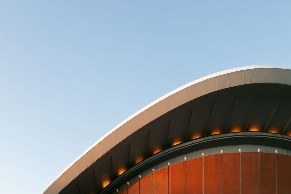 The red curved roof of Ferrari World rising above Yas Island