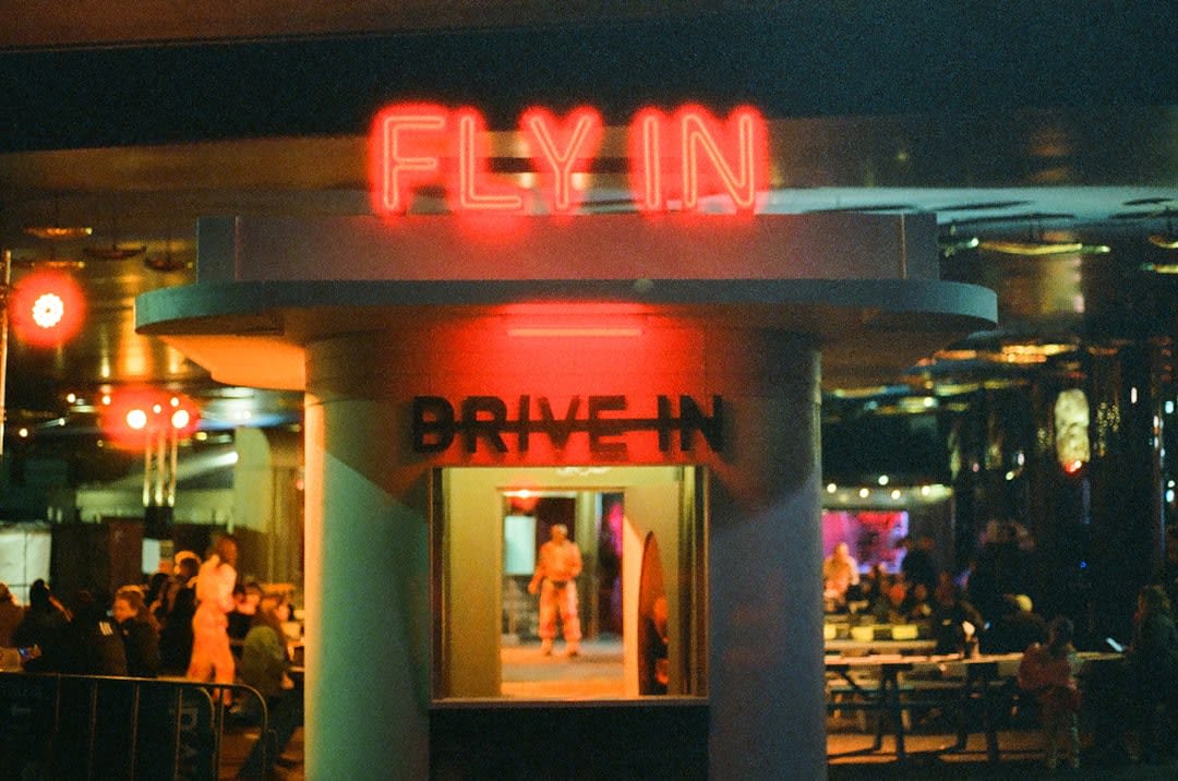 The illuminated screen and rows of parked cars at a classic drive-in movie theater near Angola, Indiana
