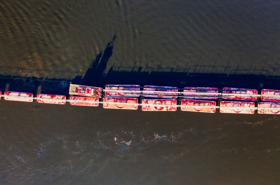 A barge tow passing through Lock and Dam No. 12 on the Mississippi River near Bellevue, Iowa