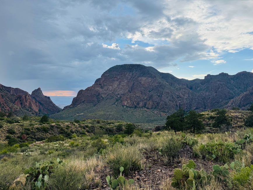 The V-shaped notch of the Window pour-off in the Chisos Mountains framing the distant desert floor far below