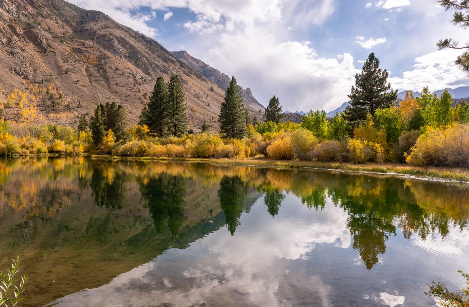 An alpine lake in Bishop Creek Canyon reflecting the Sierra peaks